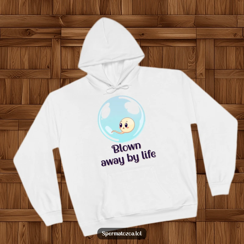 Funny sperm cell looking surprised as a giant bubble engulfs it, a cozy hoodie for humorous comfort.