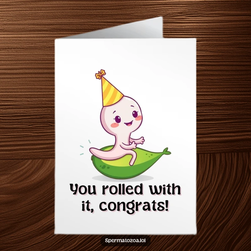 Free printable congratulations card featuring a smiling sperm cell in a party hat, riding a rolling avocado.